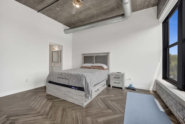 1033 W 14th Pl Unit 337, Chicago, IL 60608 - bedroom with baseboards, ensuite bathroom, and ceiling fan