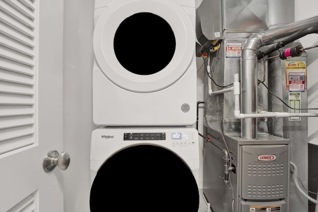 1033 W 14th Pl Unit 337, Chicago, IL 60608 - washroom featuring stacked washer / dryer and heating unit