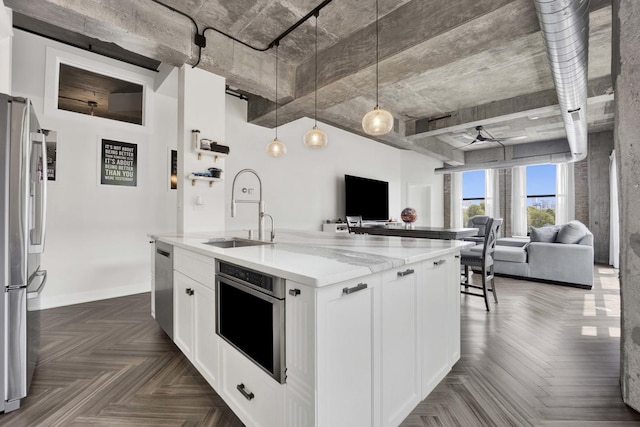 1033 W 14th Pl Unit 337, Chicago, IL 60608 - kitchen with stainless steel appliances, open floor plan, a sink, and light stone counters