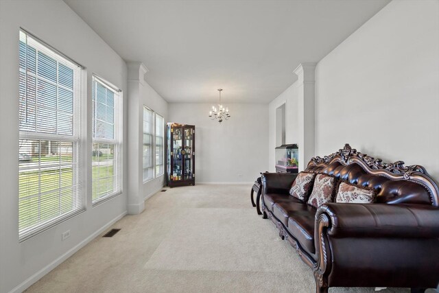 3210 Drury Ln, Carpentersville, IL 60110 - living area featuring a chandelier, light colored carpet, and baseboards