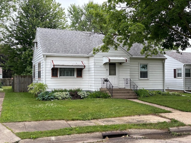 1711 17th Ave, Sterling, IL 61081 - view of front facade with roof with shingles