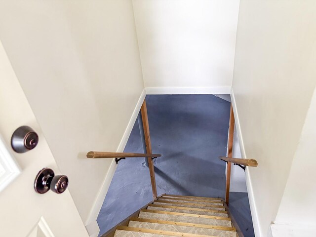 1711 17th Ave, Sterling, IL 61081 - stairs featuring baseboards