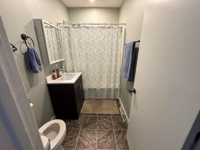 1711 17th Ave, Sterling, IL 61081 - full bathroom with toilet, vanity, curtained shower, and tile patterned flooring
