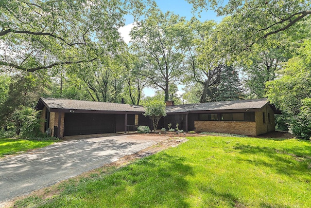71 Graymoor Ln, Olympia Fields, IL 60461 - view of grassy yard featuring a garage and driveway