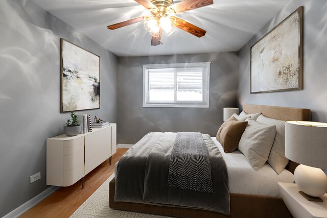 10507 S Indiana Ave, Chicago, IL 60628 - bedroom featuring wood finished floors, baseboards, and a ceiling fan