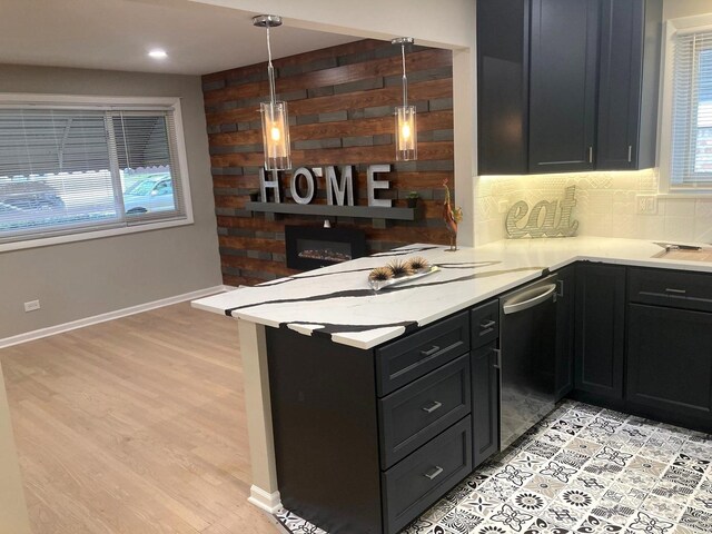 10507 S Indiana Ave, Chicago, IL 60628 - kitchen with dishwasher, light countertops, a peninsula, backsplash, and baseboards