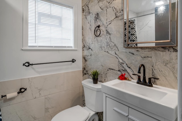 10507 S Indiana Ave, Chicago, IL 60628 - bathroom with tile walls, toilet, and vanity