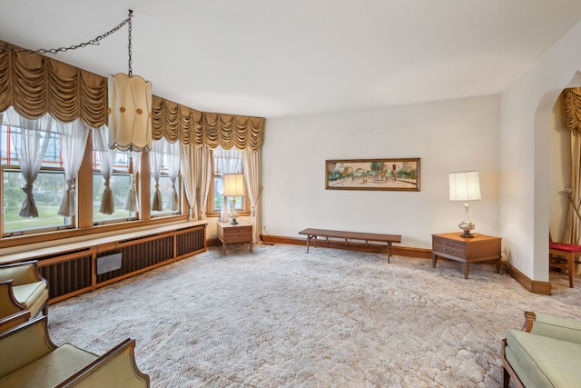 3006 N Sayre Ave, Chicago, IL 60634 - sitting room featuring carpet, baseboards, and arched walkways