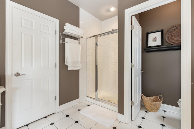 140 N Oak St, Elmhurst, IL 60126 - bathroom featuring a shower stall, toilet, and baseboards