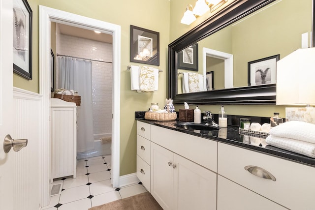 140 N Oak St, Elmhurst, IL 60126 - bathroom featuring vanity, shower / bath combo, and tile patterned flooring
