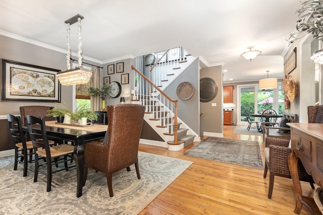 140 N Oak St, Elmhurst, IL 60126 - dining space featuring stairs, ornamental molding, baseboards, and wood finished floors