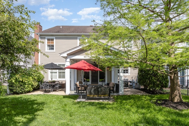140 N Oak St, Elmhurst, IL 60126 - back of property featuring a patio area and a chimney