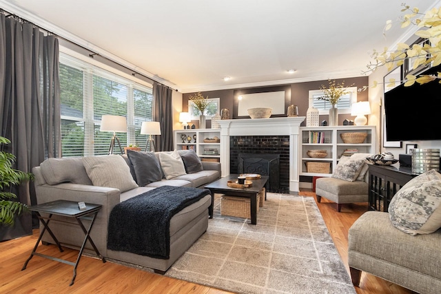 140 N Oak St, Elmhurst, IL 60126 - living room featuring ornamental molding, a chandelier, a tile fireplace, and wood finished floors