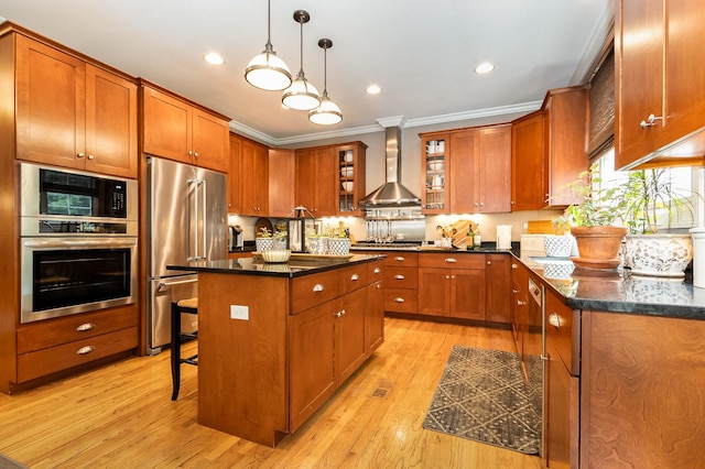 140 N Oak St, Elmhurst, IL 60126 - kitchen with stainless steel appliances, wall chimney exhaust hood, crown molding, light wood finished floors, and brown cabinetry