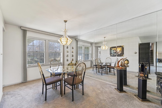 2213 Strawberry Ln, Glenview, IL 60026 - carpeted dining space with a chandelier and baseboards