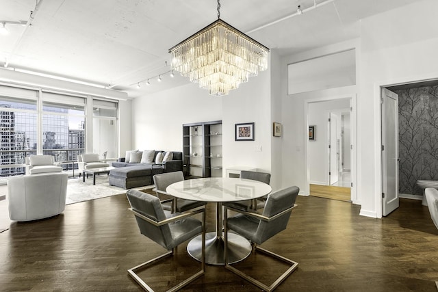 333 N Canal St Unit 2804, Chicago, IL 60606 - dining area with rail lighting, wood finished floors, and a chandelier