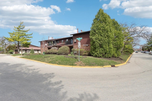 68 Pier Dr Unit 102, Westmont, IL 60559 - view of front facade with a front yard and brick siding