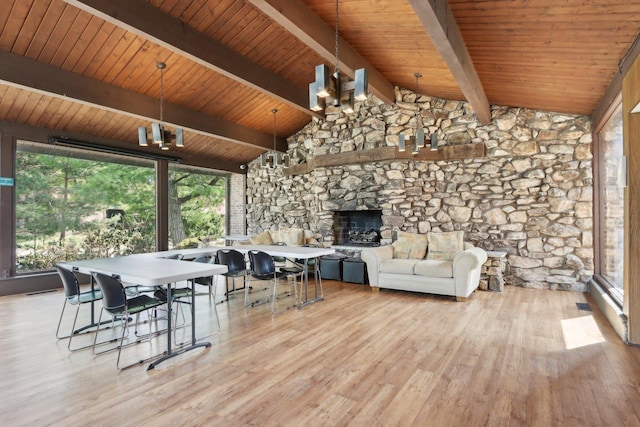 68 Pier Dr Unit 102, Westmont, IL 60559 - dining room with wood finished floors, a stone fireplace, and wood ceiling
