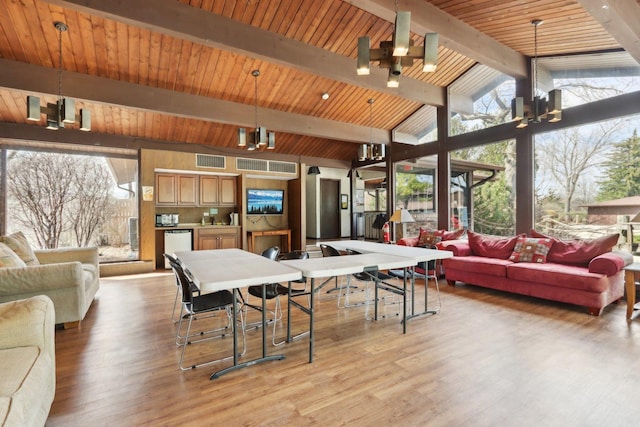 68 Pier Dr Unit 102, Westmont, IL 60559 - rec room with light wood-style floors, a chandelier, and wooden ceiling