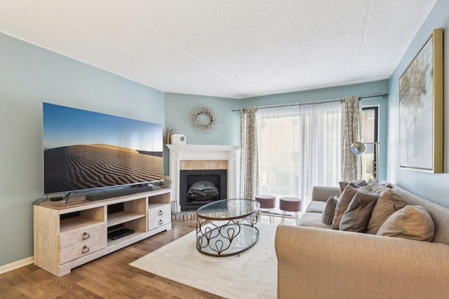 68 Pier Dr Unit 102, Westmont, IL 60559 - living room with wood finished floors and a fireplace with raised hearth