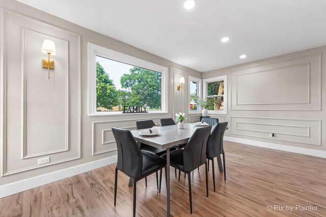 490 S Mchenry Ave, Crystal Lake, IL 60014 - dining room featuring a decorative wall, plenty of natural light, light wood-type flooring, recessed lighting, and baseboards