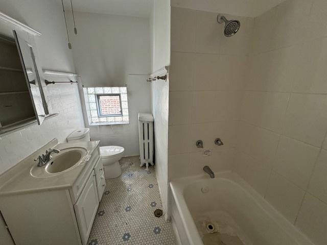 7952 S Elizabeth St, Chicago, IL 60620 - bathroom with radiator, vanity, toilet, bathing tub / shower combination, and tile patterned flooring