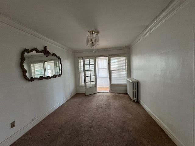 7952 S Elizabeth St, Chicago, IL 60620 - carpeted spare room featuring crown molding, radiator, and baseboards