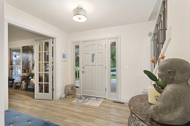 304 Fairhaven Dr, Winthrop Harbor, IL 60096 - entryway with light wood-style floors and baseboards