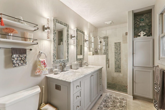 304 Fairhaven Dr, Winthrop Harbor, IL 60096 - bathroom featuring a stall shower, double vanity, and tile patterned flooring