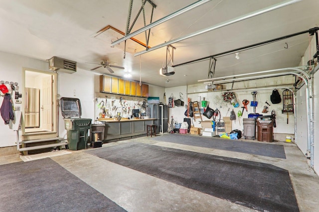 304 Fairhaven Dr, Winthrop Harbor, IL 60096 - garage with a workshop area, a garage door opener, and a heating unit