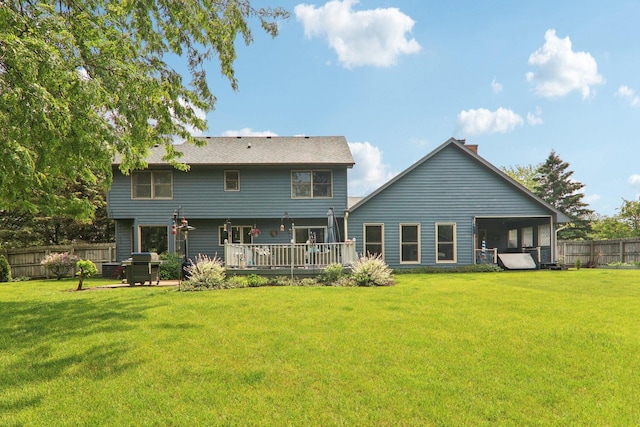 304 Fairhaven Dr, Winthrop Harbor, IL 60096 - rear view of property with a deck and a chimney