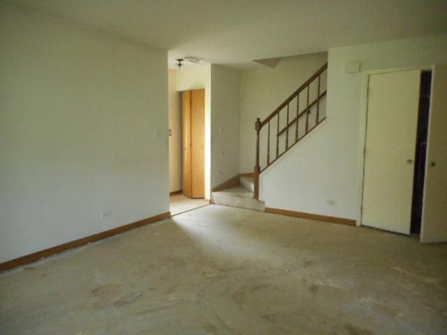 464 Buchanan Ct, Vernon Hills, IL 60061 - empty room with stairway and baseboards
