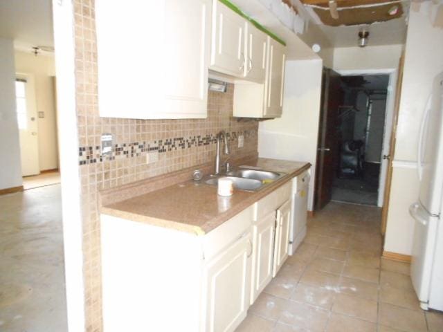 464 Buchanan Ct, Vernon Hills, IL 60061 - kitchen featuring a sink, decorative backsplash, freestanding refrigerator, white cabinetry, and light tile patterned flooring