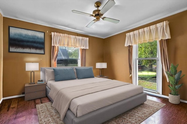 424 Howard Ave, Aurora, IL 60506 - bedroom with crown molding, multiple windows, wood finished floors, baseboards, and a ceiling fan