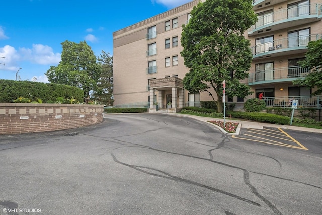 4747 Howard St Unit 205, Skokie, IL 60076 - view of building exterior featuring uncovered parking