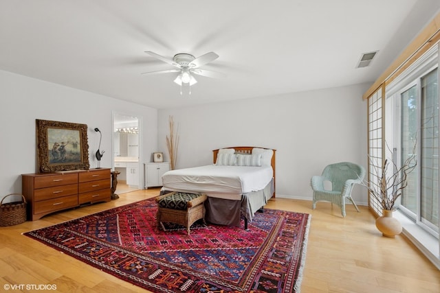 4747 Howard St Unit 205, Skokie, IL 60076 - bedroom featuring light wood-style floors, ensuite bathroom, and ceiling fan