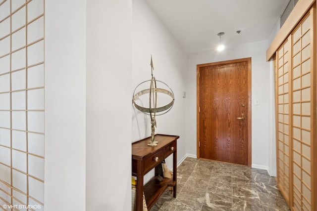 4747 Howard St Unit 205, Skokie, IL 60076 - doorway to outside featuring marble finish flooring and baseboards