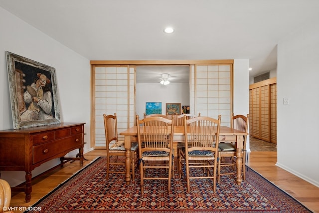 4747 Howard St Unit 205, Skokie, IL 60076 - dining area with wood finished floors, a ceiling fan, and recessed lighting