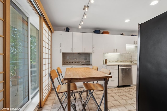 4747 Howard St Unit 205, Skokie, IL 60076 - kitchen featuring appliances with stainless steel finishes, light countertops, decorative backsplash, and recessed lighting