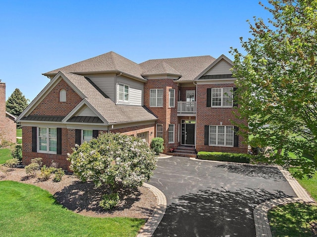 4 Tournament Dr S, Hawthorn Woods, IL 60047 - view of front of house with a balcony, driveway, brick siding, roof with shingles, and a garage