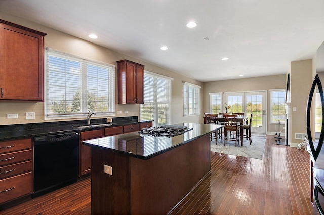 4 Tournament Dr S, Hawthorn Woods, IL 60047 - kitchen featuring black dishwasher, a sink, gas cooktop, a center island, and dark wood-type flooring