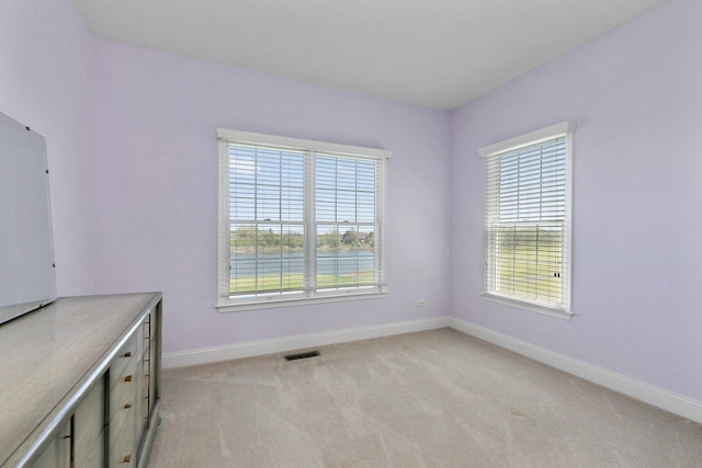 4 Tournament Dr S, Hawthorn Woods, IL 60047 - unfurnished dining area featuring healthy amount of natural light, baseboards, and light carpet