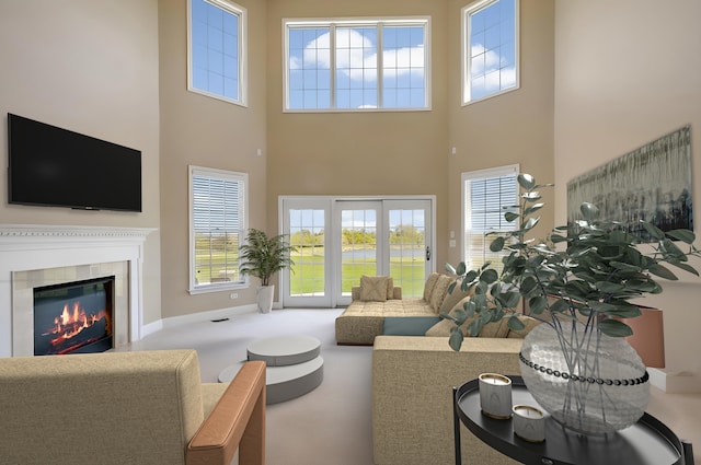 4 Tournament Dr S, Hawthorn Woods, IL 60047 - living room with a towering ceiling, a glass covered fireplace, plenty of natural light, and baseboards