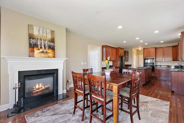 4 Tournament Dr S, Hawthorn Woods, IL 60047 - dining room featuring dark wood-style floors, recessed lighting, a glass covered fireplace, and baseboards