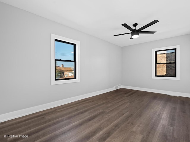 1910 W 83rd St, Chicago, IL 60620 - empty room featuring dark wood finished floors, baseboards, and ceiling fan