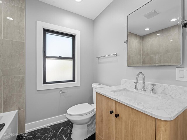 1910 W 83rd St, Chicago, IL 60620 - full bath with marble finish floors, vanity, toilet, and baseboards