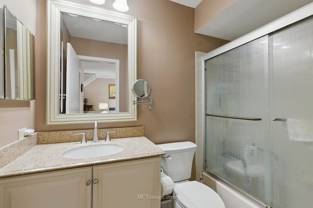 bathroom with vanity and enclosed tub / shower combo