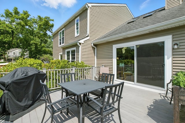wooden deck with outdoor dining space