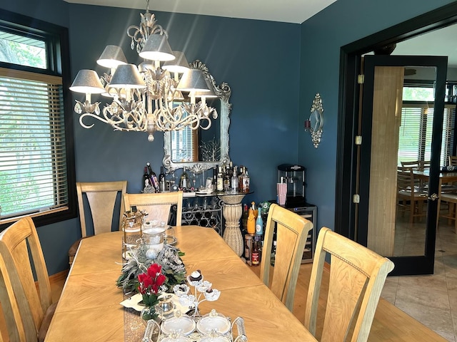 1S701 Eisenhower Rd, Oakbrook Terrace, IL 60181 - tiled dining room featuring a chandelier and plenty of natural light