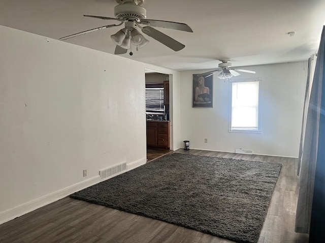 14701 E Riverside Dr, South Holland, IL 60473 - spare room featuring a ceiling fan, wood finished floors, and baseboards